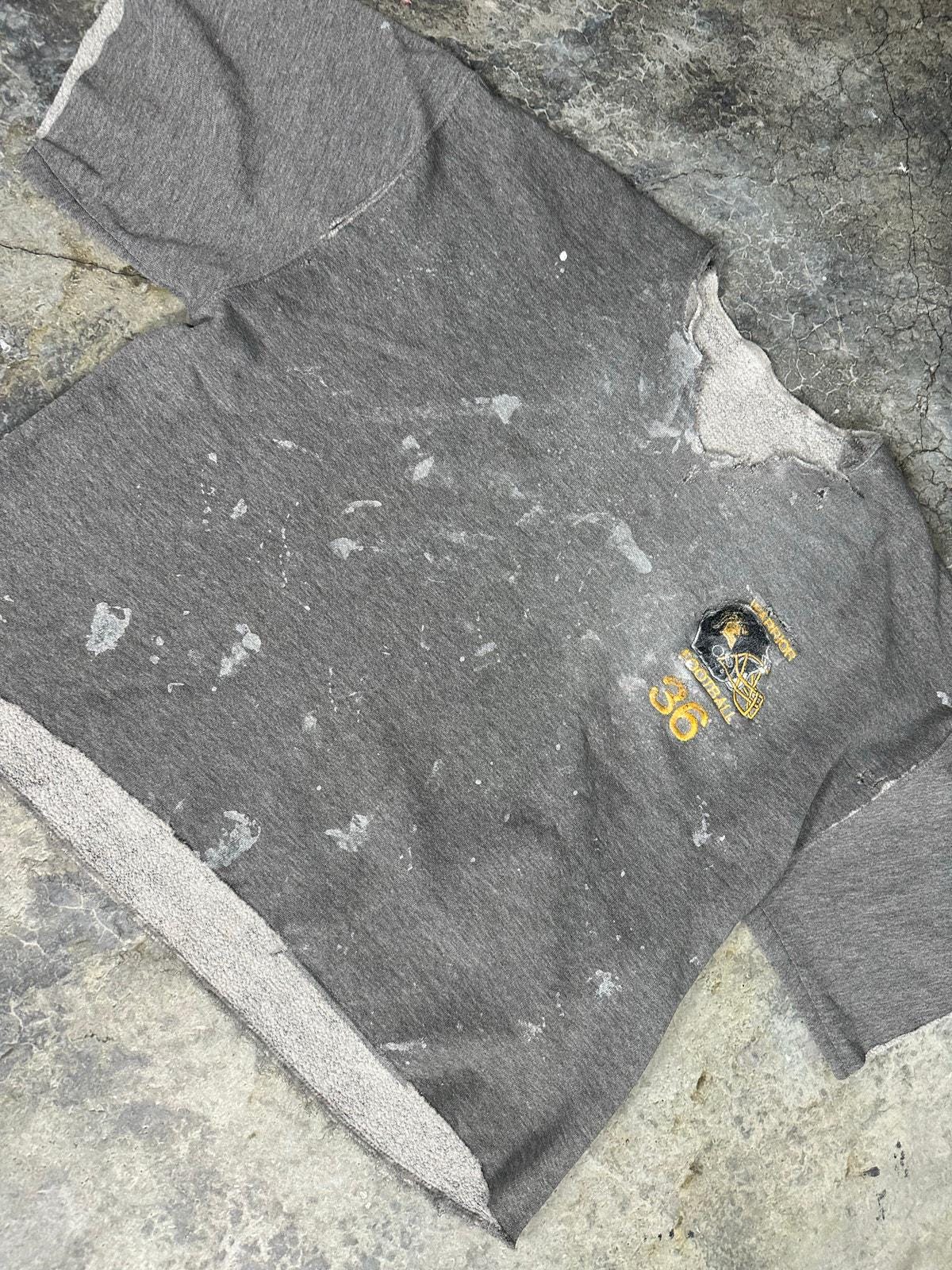 Thrashed Russel’s Athletics sweater